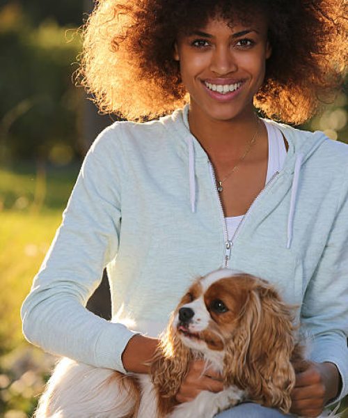 young pretty black student with her dog